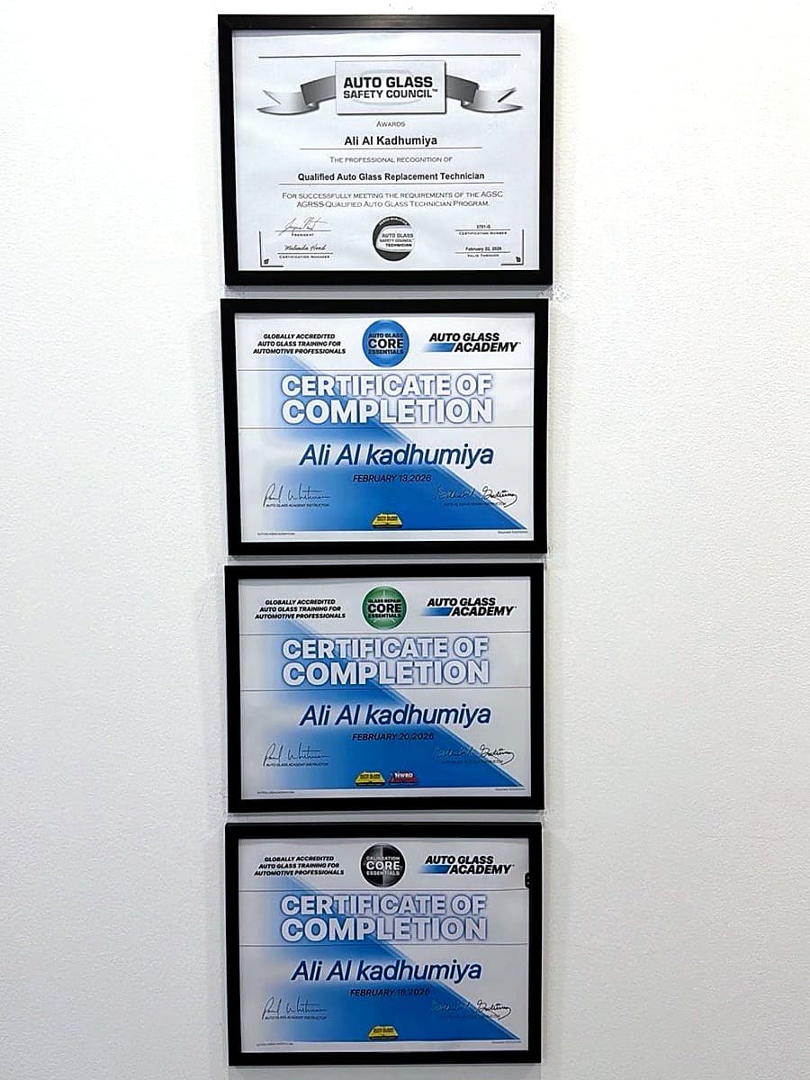 Training certificates displayed at the Glow Auto Glass shop